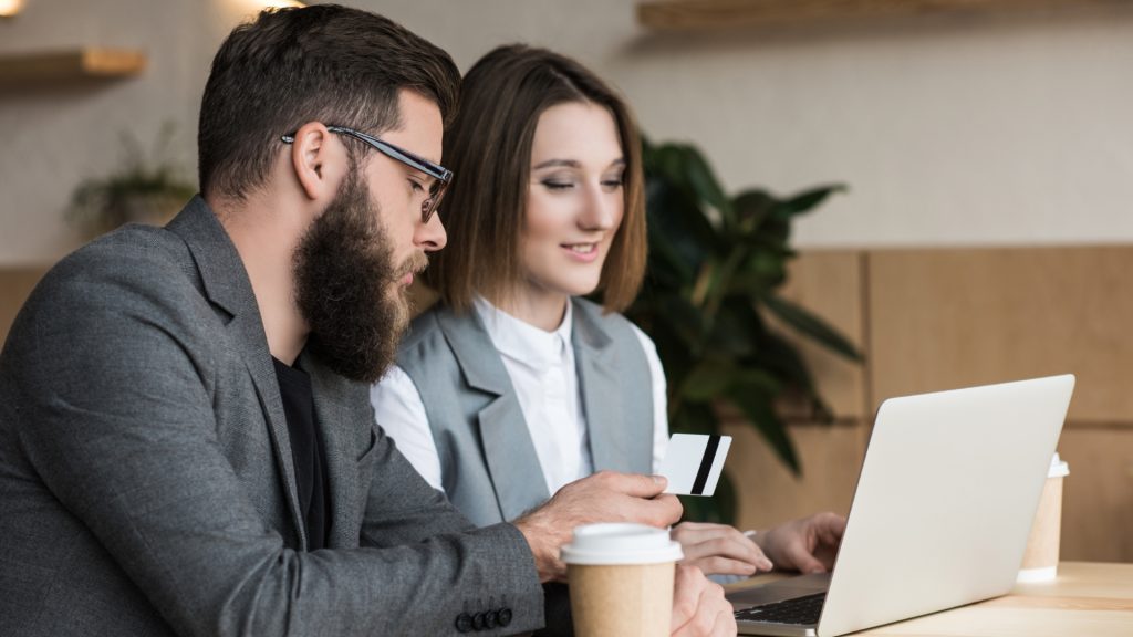 Two professionals collaborating on a digital marketing project, representing the expertise and accountability offered by a dedicated agency.
